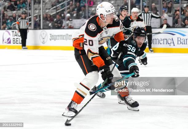 Brett Leason of the Anaheim Ducks gets his shot pass the stick of Mike Hoffman of the San Jose Sharks scoring a short handed goal in the first period...