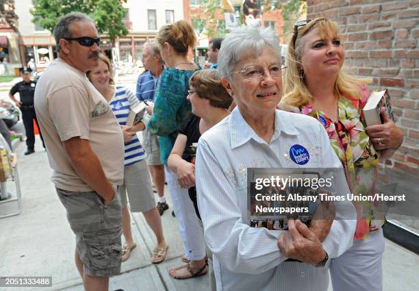 Lois Fink, second from right, and her daughter Catherine Harris, right, both of Saratoga Springs wait in a long line to have former Secretary of...