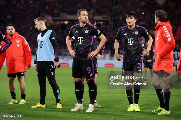 Harry Kane of Bayern Munich looks dejected as players of Bayern Munich acknowledge the fans after drawing with SC Freiburg during the Bundesliga...