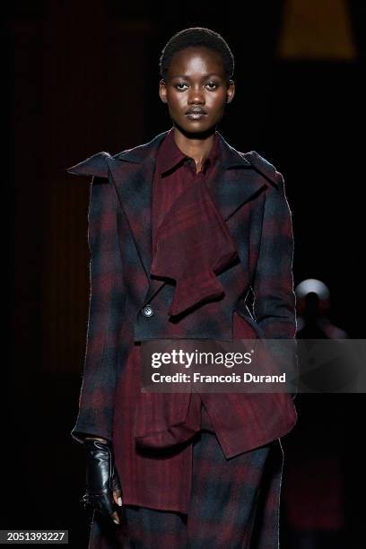 Model walks the runway during the Yohji Yamamoto Womenswear Fall/Winter 2024-2025 show as part of Paris Fashion Week on March 01, 2024 in Paris,...