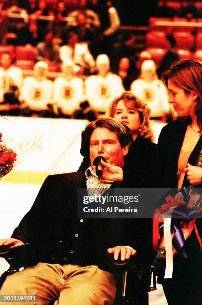 Christopher Reeve is presented with a $50,000 check for the Christopher Reeve Foundation by IBM and The New York Rangers as part of the IBM Power...