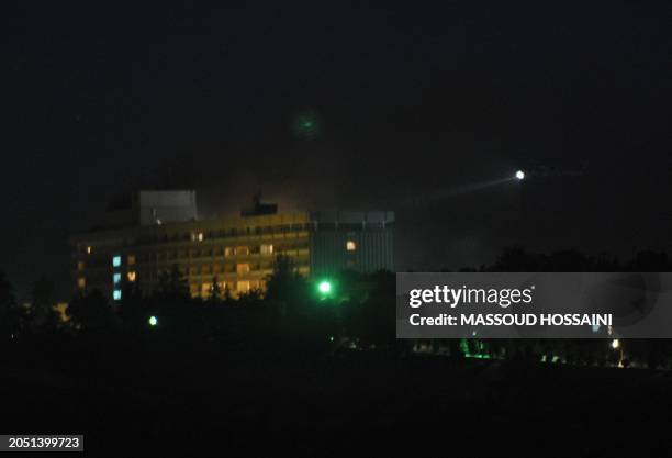 Helicopter flies around the Intercontinental hotel in response to an attack on the hotel by Taliban fighters in Kabul on June 29, 2011. Taliban...