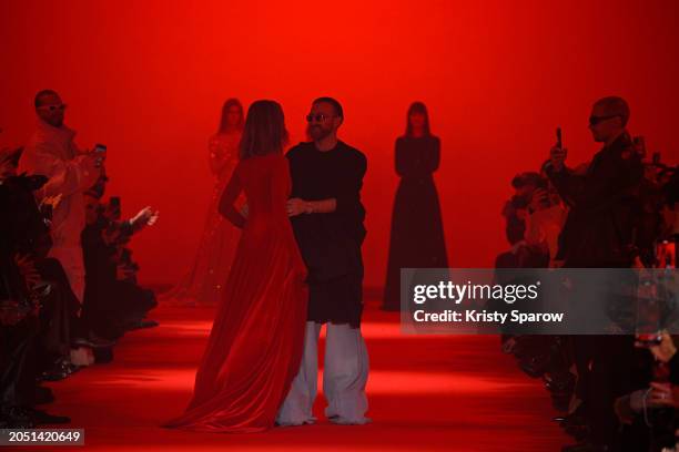 Creative Director Guram Gvasalia acknowledges the audience with Natalia Vodianova during the Vetements Womenswear Fall/Winter 2024-2025 show as part...