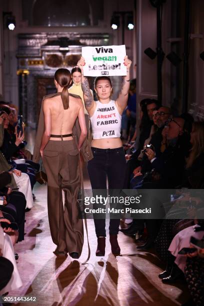 Peta activist is seen on the runways as a model walks during the Victoria Beckham Womenswear Fall/Winter 2024-2025 show as part of Paris Fashion Week...