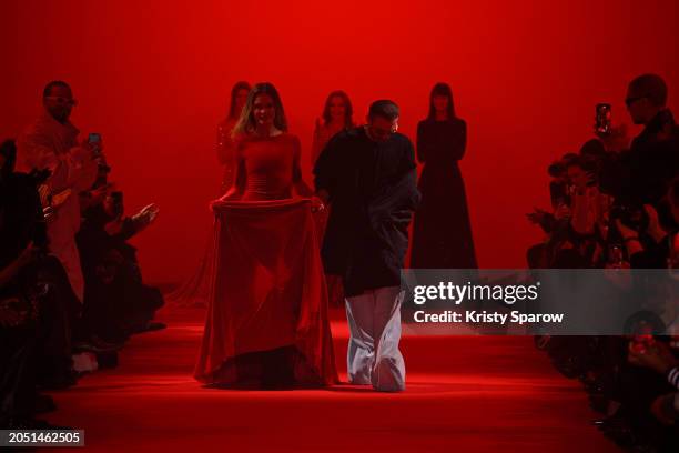 Creative Director Guram Gvasalia acknowledges the audience with Natalia Vodianova during the Vetements Womenswear Fall/Winter 2024-2025 show as part...