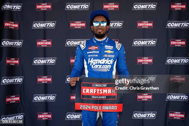 Rajah Caruth, driver of the HendrickCars.com Chevrolet, poses for photos after winning the pole award during qualifying for the NASCAR Craftsman...