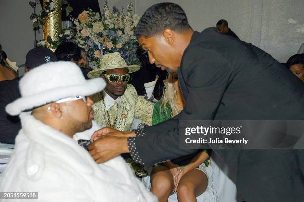 Don "Magic" Juan watches Fonzworth Bentley fixing Chad "Pimp C" Butler's tie on the set of UGK & OutKast's "Int'l Players Anthem " video shoot on May...