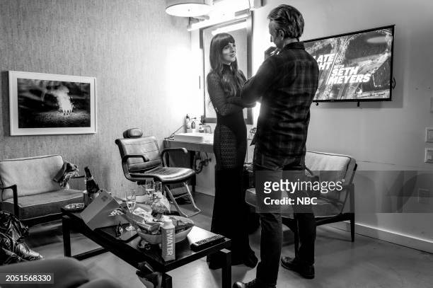 Episode 1482 -- Pictured: Actress Dakota Johnson talks with host Seth Meyers backstage on February 7, 2024 --