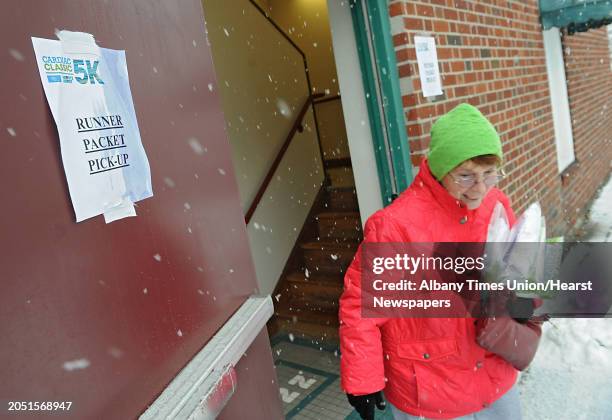 Kathy Higgins of Rotterdam picks up packets for her, her daughter and two grandsons for the Ellis Medicine's Cardiac Classic 5K in Schenectady...