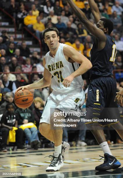 Siena's Brett Bisping drives to the hoop during a basketball game against Quinnipiac at the Times Union Center on Friday, Dec. 5, 2014 in Albany, N.Y.