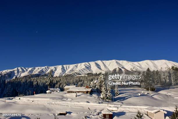 Hotels are seen in the morning after a snowstorm at Gulmarg Ski Resort in Baramulla district, Indian Administered Kashmir, on March 3, 2024.