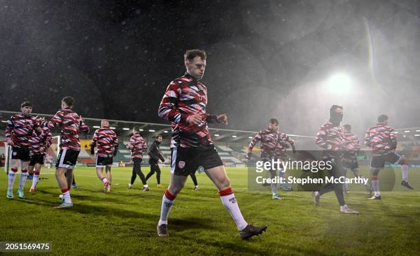 Dublin , Ireland - 4 March 2024; Derry City player Cameron McJannet and teammates warm up before the SSE Airtricity Men's Premier Division match...