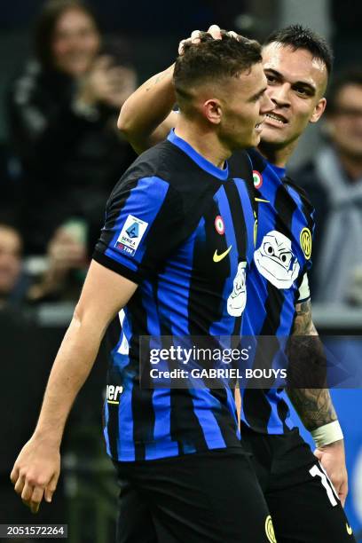 Inter Milan's Albanian midfielder Kristjan Asllani celebrates with Inter Milan's Argentine forward Lautaro Martinez afte scoring his team's first...