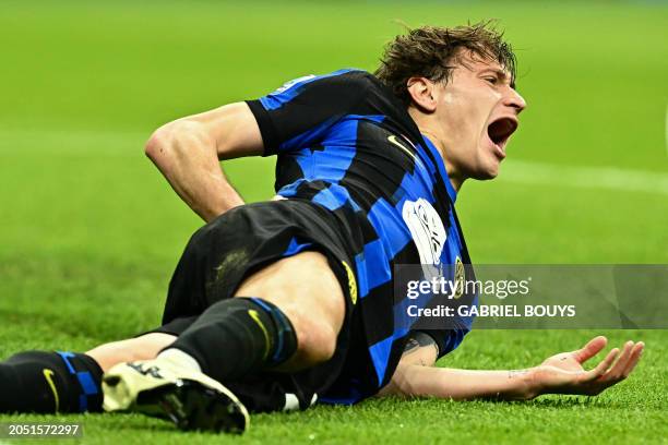 Inter Milan's Italian midfielder Nicolo Barella reacts after being fouled during the Italian Serie A football match between Inter Milan and Genoa at...