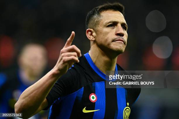 Inter Milan's Chilean forward Alexis Sanchez celebrates scoring his team's second goal on a penalty kick during the Italian Serie A football match...