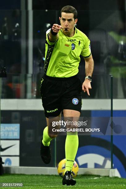 Italian referee Giovanni Ayroldi confirms a penalty kick after consulting VAR during the Italian Serie A football match between Inter Milan and Genoa...