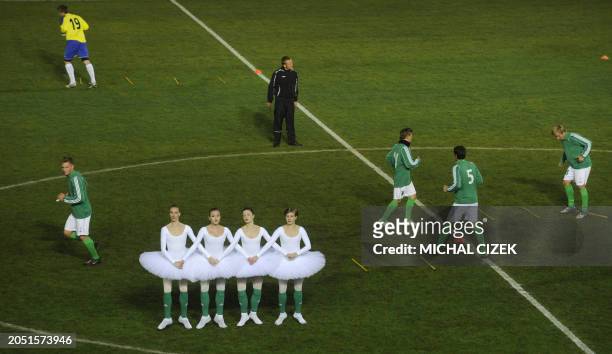 Ballet dancers and members of Bohemians 1905 junior football team perform on the field on October 22, 2011 at the Czech famous Bohemians 1905 stadium...