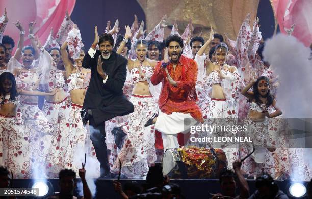 Indian actor Amitabh Bachchan and his son Abhishek Bachchan during the International Indian Film Academy Awards ceremony at the Hallam Arena in...