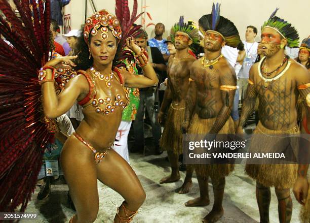 Mel Britto , the queen of the drums of Caprichosos de Pilares samba school, performs ahead of the musicians while their school opens the first night,...