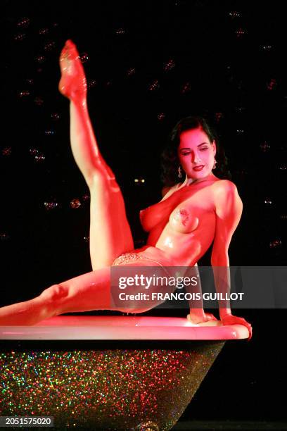 Dancer and model Dita von Teese performs a strip-tease, 23 October 2006 at the Crazy Horse saloon in Paris. Von Teese is giving eight performances of...