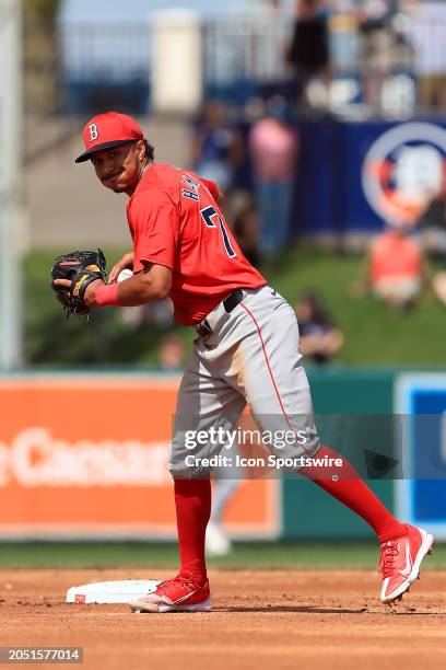 Boston Red Sox infielder David Hamilton throws the ball over to first base during the spring training game between the Boston Red Sox and the Detroit...