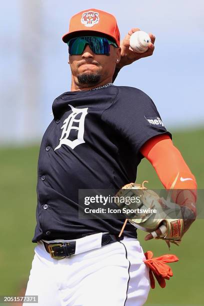 Detroit Tigers infielder Javier Baez throws the ball over to first base during the spring training game between the Boston Red Sox and the Detroit...