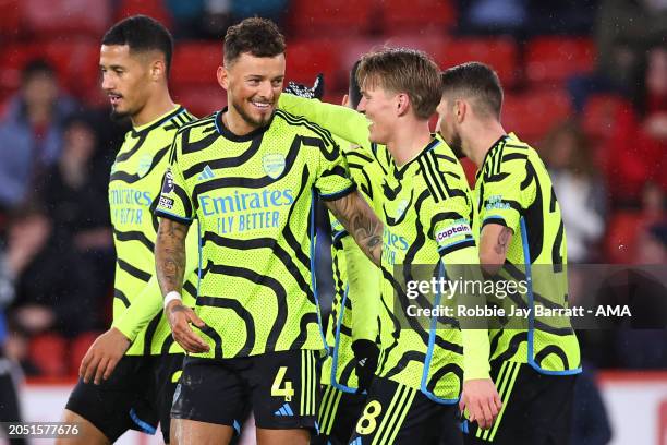 Ben White of Arsenal celebrates with team mates after scoring a goal to make it 0-6 during the Premier League match between Sheffield United and...