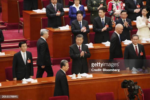Xi Jinping, China's president, center, Li Qiang, China's premier, right, Wang Huning, chairman of the Chinese People's Political Consultative...