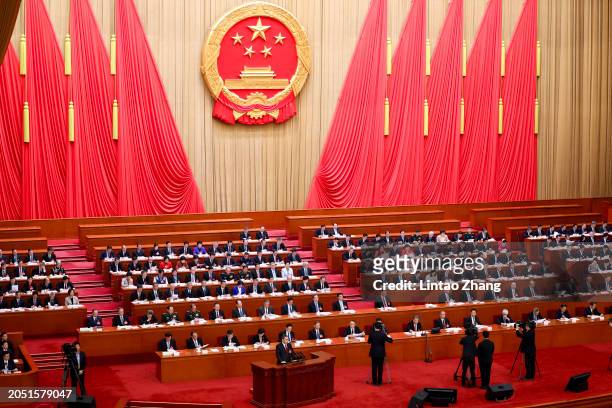 Chinese Premier Li Qiang delivers a speech during the opening of the second session of the 14th National People's Congress at The Great Hall of...
