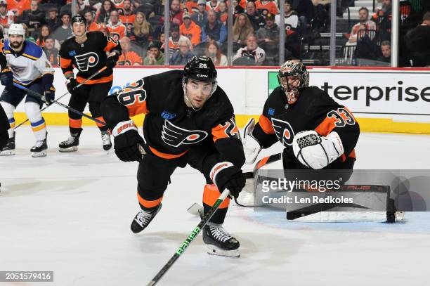 Sean Walker and Samuel Ersson of the Philadelphia Flyers react to the play in their zone against the St Louis Blues at the Wells Fargo Center on...