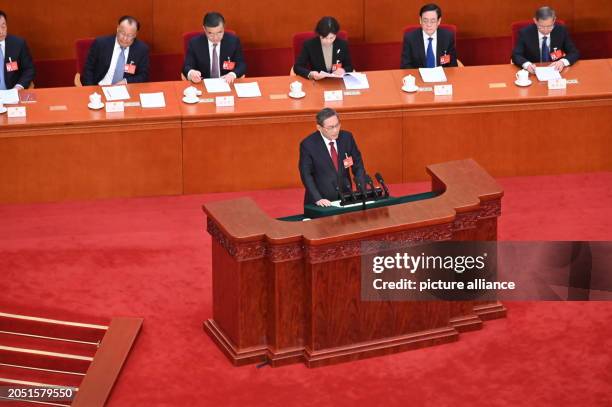 March 2024, China, Peking: Li Qiang, Prime Minister of China, speaks in the plenary hall of the Great Hall of the People. Despite considerable...