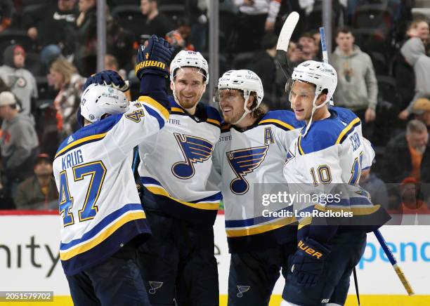 Pavel Buchnevich of the St Louis Blues celebrates his shootout winning goal with teammates Torey Krug, Robert Thomas and Brayden Schenn against the...