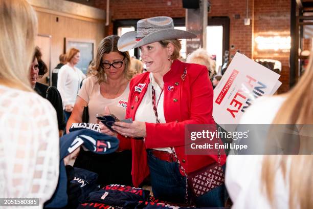 Attendees converse and get merchandise prior to the start of Republican presidential candidate, former U.N. Ambassador Nikki Haley's rally on March...