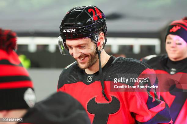 New Jersey Devils defenseman Colin Miller walks to the ice during a practice for the NHL Stadium Series on February 16, 2024 at Metlife Stadium in...