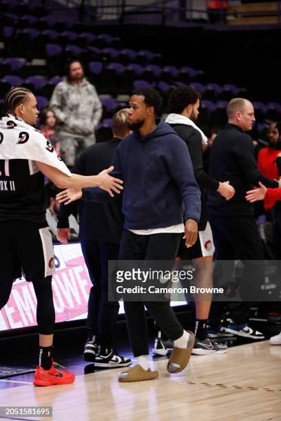 Rodney Hood of the Memphis Hustle congratulates Kevin Knox during the game against the Rip City Remix on March 4, 2024 at Chiles Center in Portland,...