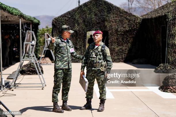 Hundreds of military personnel representing Thailand and the United States of America participate in a Strategic Airborne Operation exercise as a...