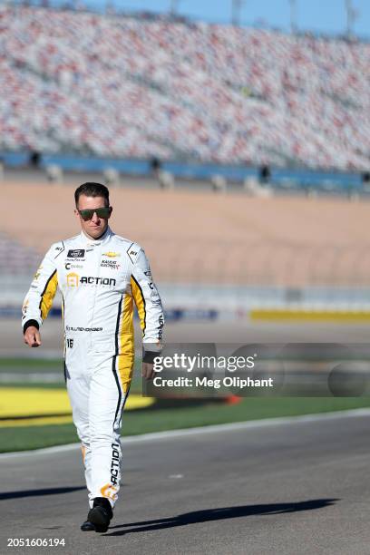 Allmendinger, driver of the Action Industries Chevrolet, walks the grid during practice for the NASCAR Xfinity Series The LiUNA! at Las Vegas Motor...