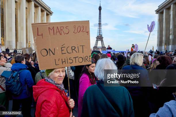 People gathered near the Eiffel Tower at the Place du Trocadero in Paris on March 4 to celebrate the inclusion of the right to abortion in the French...