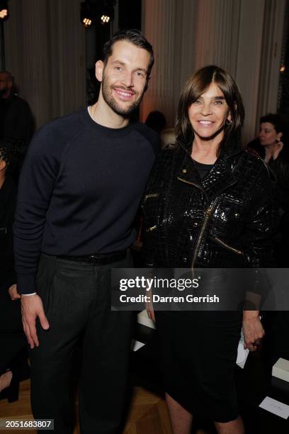 Simon Porte Jacquemus and Carine Roitfeld arrive at the Victoria Beckham AW24 show during Paris Fashion Week on March 01, 2024 in Paris, France.