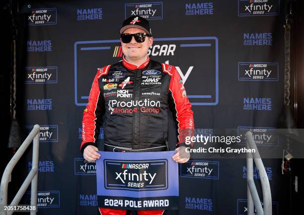 Cole Custer, driver of the Production Alliance Group Ford, poses for photos after winning the pole award during qualifying for the NASCAR Xfinity...
