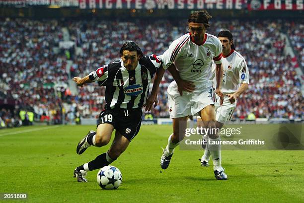 Paolo Maldini of AC Milan chases Gianluca Zambrotta of Juventus for the ball during the UEFA Champions League Final match between Juventus FC and AC...