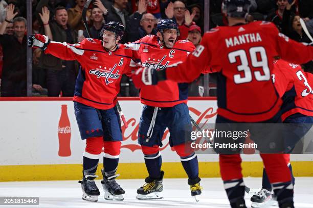 John Carlson of the Washington Capitals celebrates his goal with teammate Alex Ovechkin of the Washington Capitals against the Philadelphia Flyers...