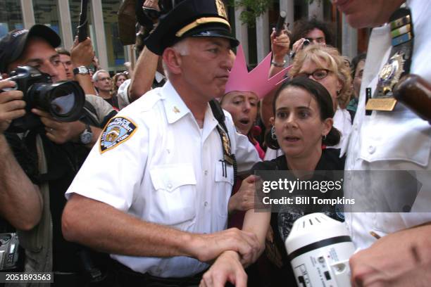 Protest leader Andrea Buffer arrested during the Republican National Convention in New York City in front of FOX NEWS chanting against Bill O'Reilly...