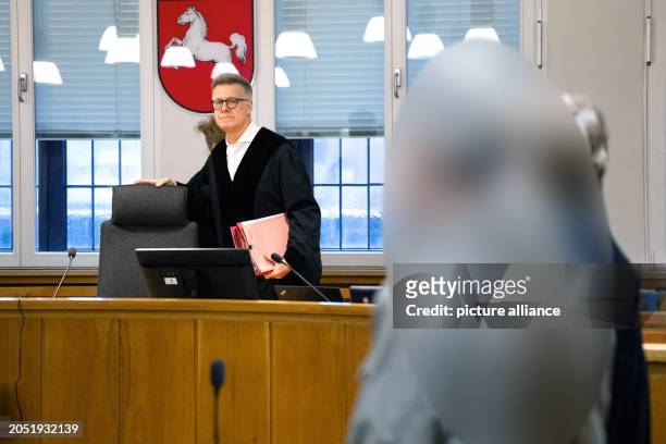 March 2024, Lower Saxony, Oldenburg: Sebastian Bührmann, presiding judge, enters the courtroom in the district court where the defendant is standing...