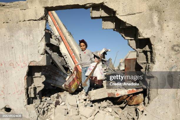 Palestinian children, who left their homes and took refuge in safe areas with their families in order to protect themselves, collect wood, paper and...