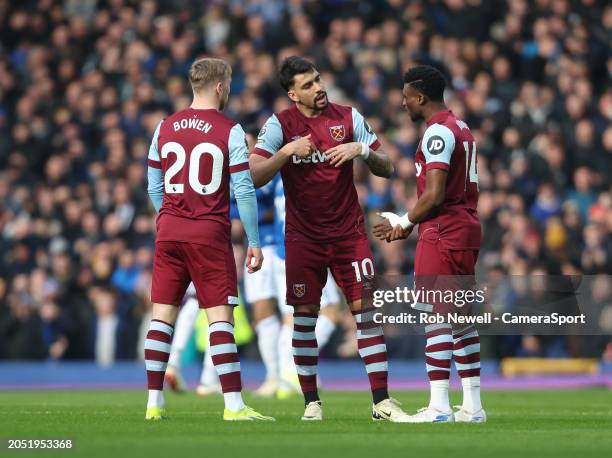 West Ham United's Lucas Paqueta in discussion with Jarrod Bowen and Mohammed Kudus during the Premier League match between Everton FC and West Ham...