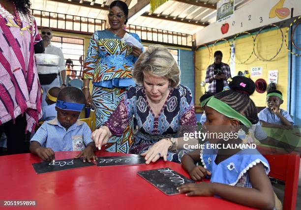 Queen Mathilde of Belgium meets children as she visits the Mamie Faitai preschool in Yopougon, Yop City, a suburb of Abidjan, Ivory Coast on Tuesday...