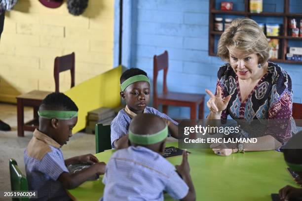 Queen Mathilde of Belgium meets children as she visits the Mamie Faitai preschool in Yopougon, Yop City, a suburb of Abidjan, Ivory Coast on Tuesday...