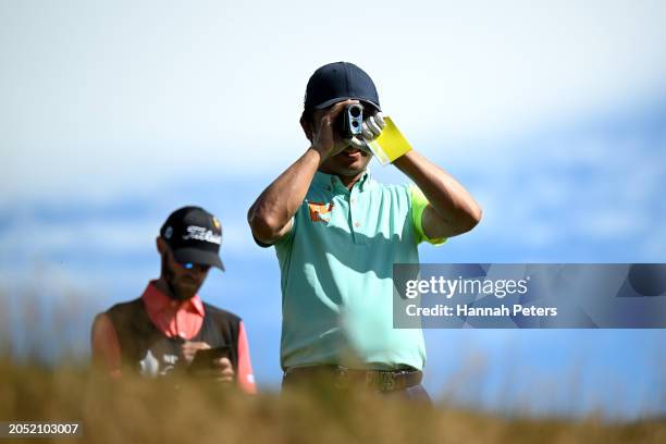 Kodai Ichihara of Japan looks through his range finder during day three of the 2024 New Zealand Golf Open at Millbrook Resort on March 02, 2024 in...