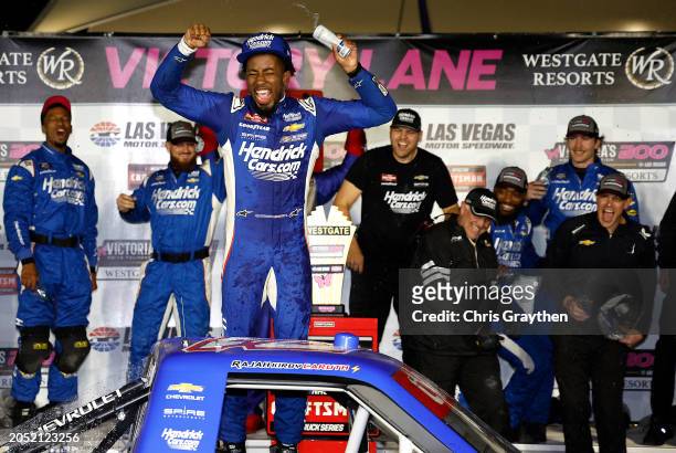 Rajah Caruth, driver of the HendrickCars.com Chevrolet, celebrates in victory lane after winning the NASCAR Craftsman Truck Series Victoria's Voice...